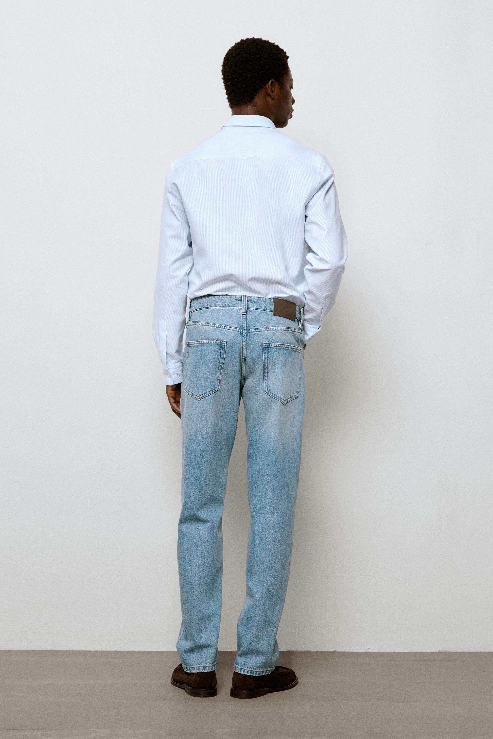Bleach washed tapered fit jeans